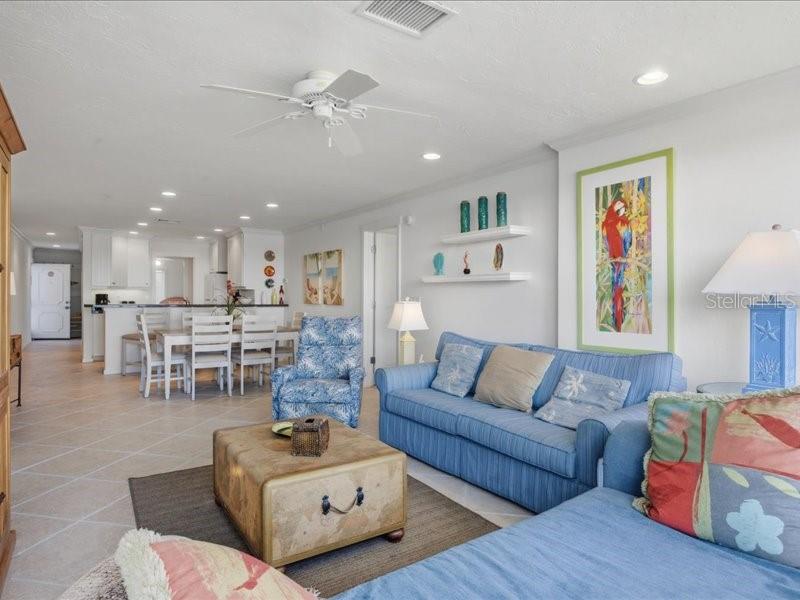 8911 Midnight Pass Road, Unit 208 Sarasota, FL 34242 - Photo 11 of 46 a living room with furniture and a view of kitchen