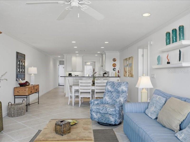 8911 Midnight Pass Road, Unit 208 Sarasota, FL 34242 - Photo 12 of 46 a living room with furniture and kitchen view