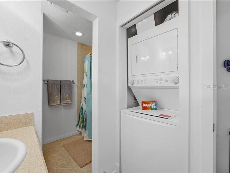 8911 Midnight Pass Road, Unit 208 Sarasota, FL 34242 - Photo 20 of 46 a bathroom with a toilet and a shower