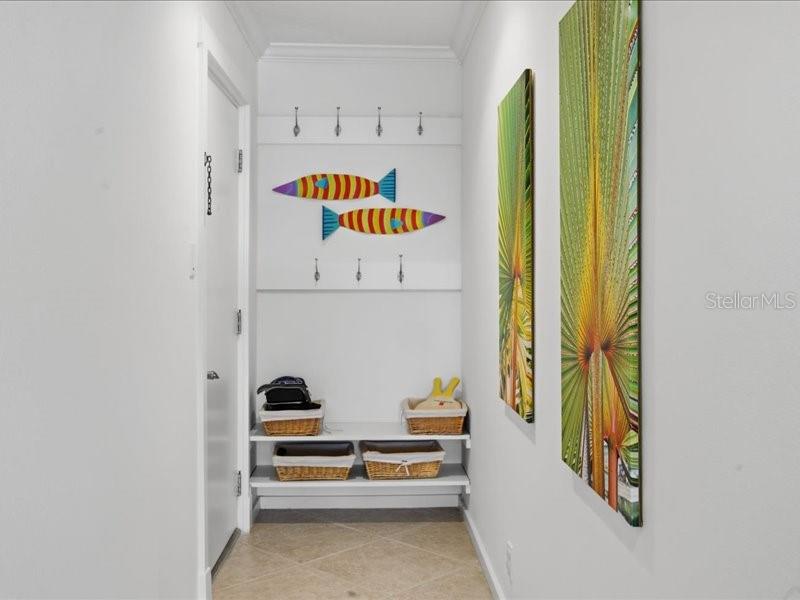 8911 Midnight Pass Road, Unit 208 Sarasota, FL 34242 - Photo 23 of 46 a view of a hallway with painted walls