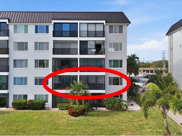 8911 Midnight Pass Road, Unit 208 Sarasota, FL 34242 - Photo 26 of 46 a front view of a multi story building