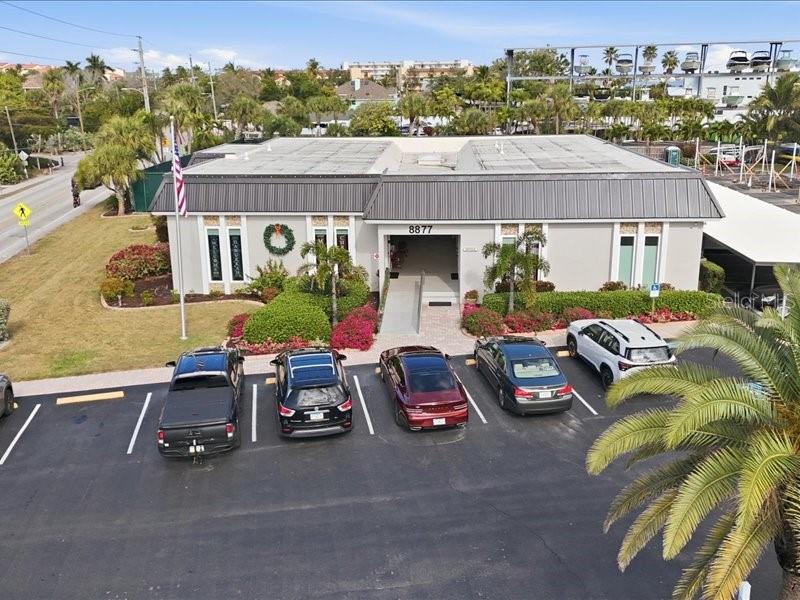 8911 Midnight Pass Road, Unit 208 Sarasota, FL 34242 - Photo 29 of 46 a car parked in front of a house
