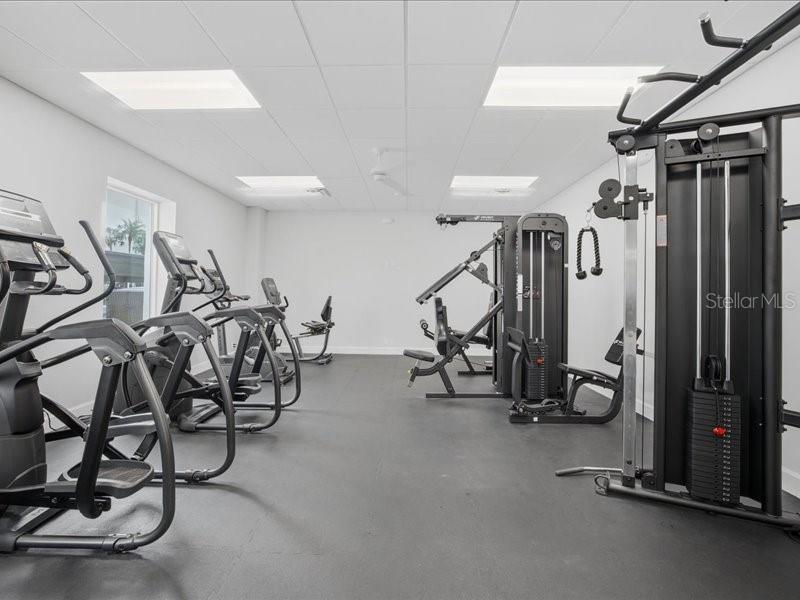 8911 Midnight Pass Road, Unit 208 Sarasota, FL 34242 - Photo 31 of 46 a view of a room with gym equipment