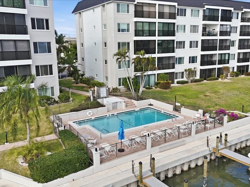 8911 Midnight Pass Road, Unit 208 Sarasota, FL 34242 - Photo 36 of 46 a view of a house with a yard