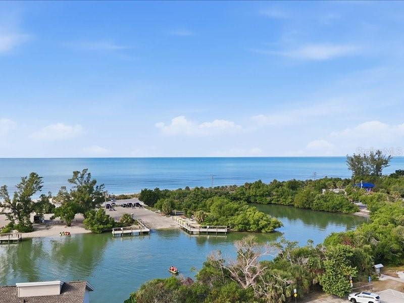 8911 Midnight Pass Road, Unit 208 Sarasota, FL 34242 - Photo 37 of 46 an aerial view of ocean and residential houses with outdoor space