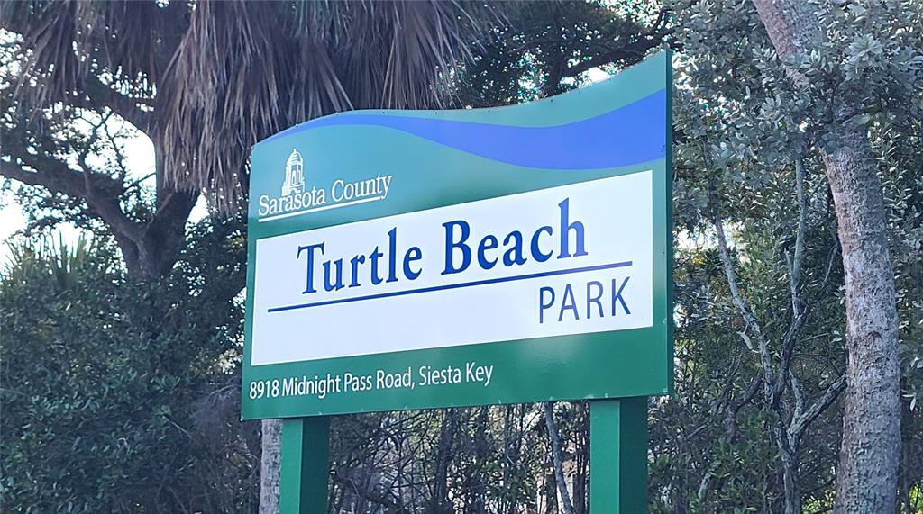 8911 Midnight Pass Road, Unit 208 Sarasota, FL 34242 - Photo 38 of 46 a sign on the side of a building