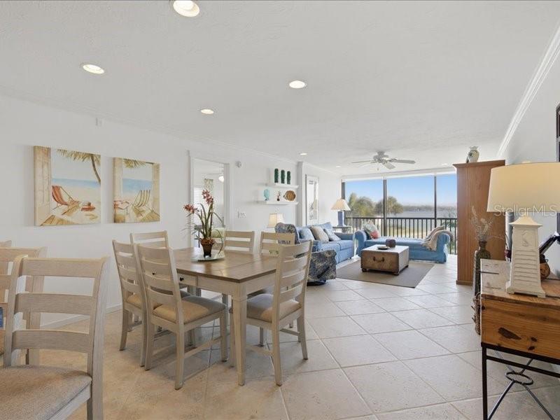 8911 Midnight Pass Road, Unit 208 Sarasota, FL 34242 - Photo 4 of 46 a view of a dining room with furniture