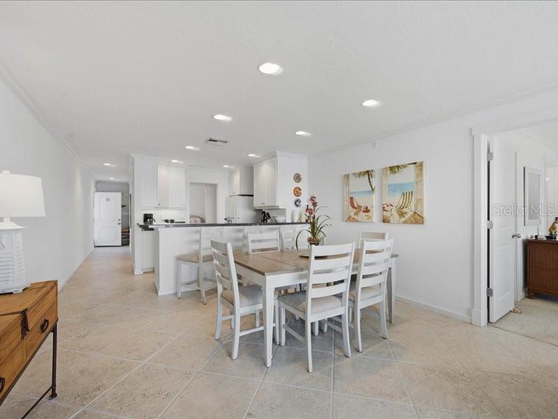 8911 Midnight Pass Road, Unit 208 Sarasota, FL 34242 - Photo 8 of 46 a view of a dining area with furniture