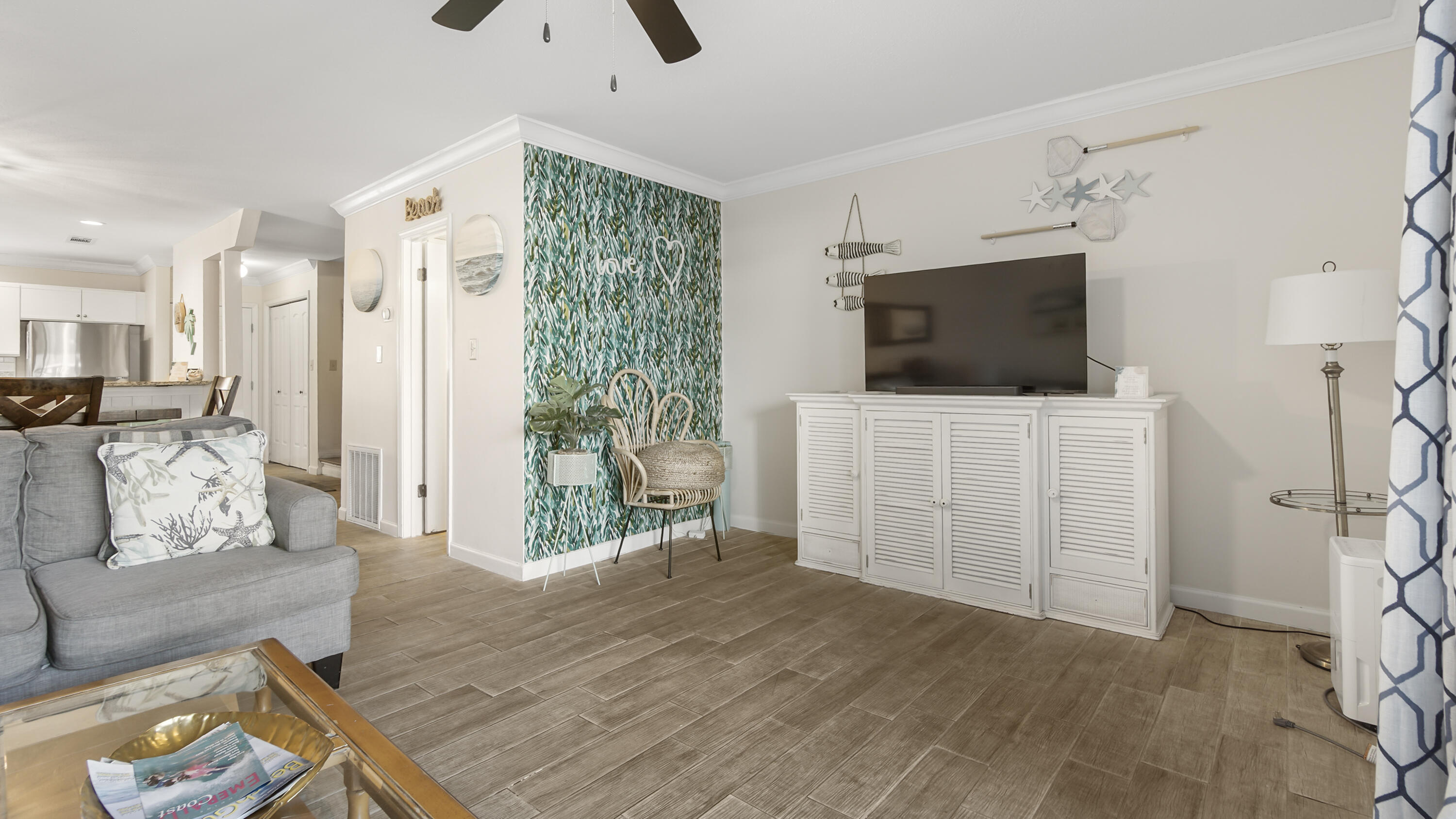 25 Misty Cove, Unit 116 Miramar Beach, FL 32550 - Photo 15 of 52 a living room with furniture and a flat screen tv