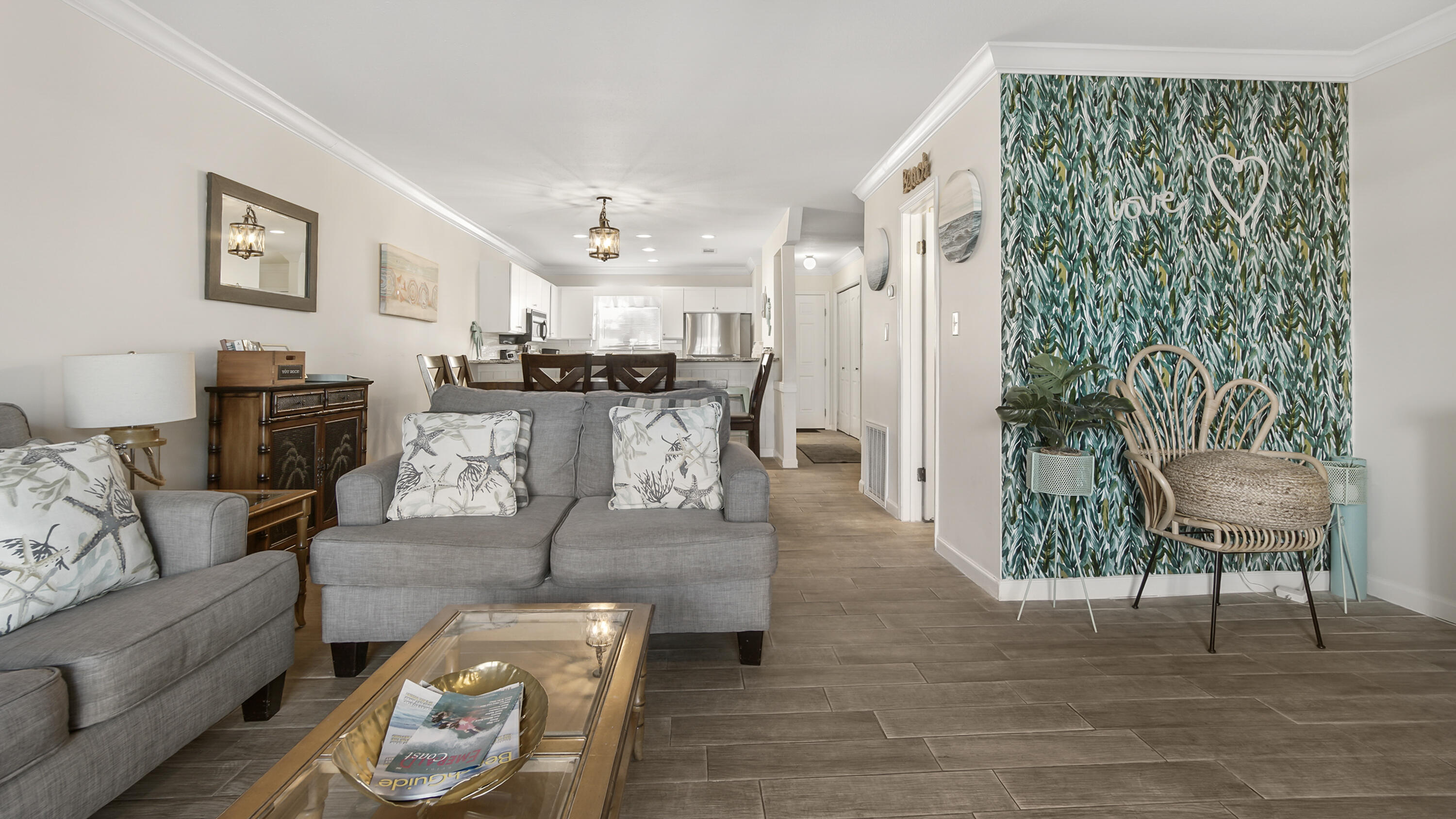25 Misty Cove, Unit 116 Miramar Beach, FL 32550 - Photo 16 of 52 a living room with furniture and a wooden floor