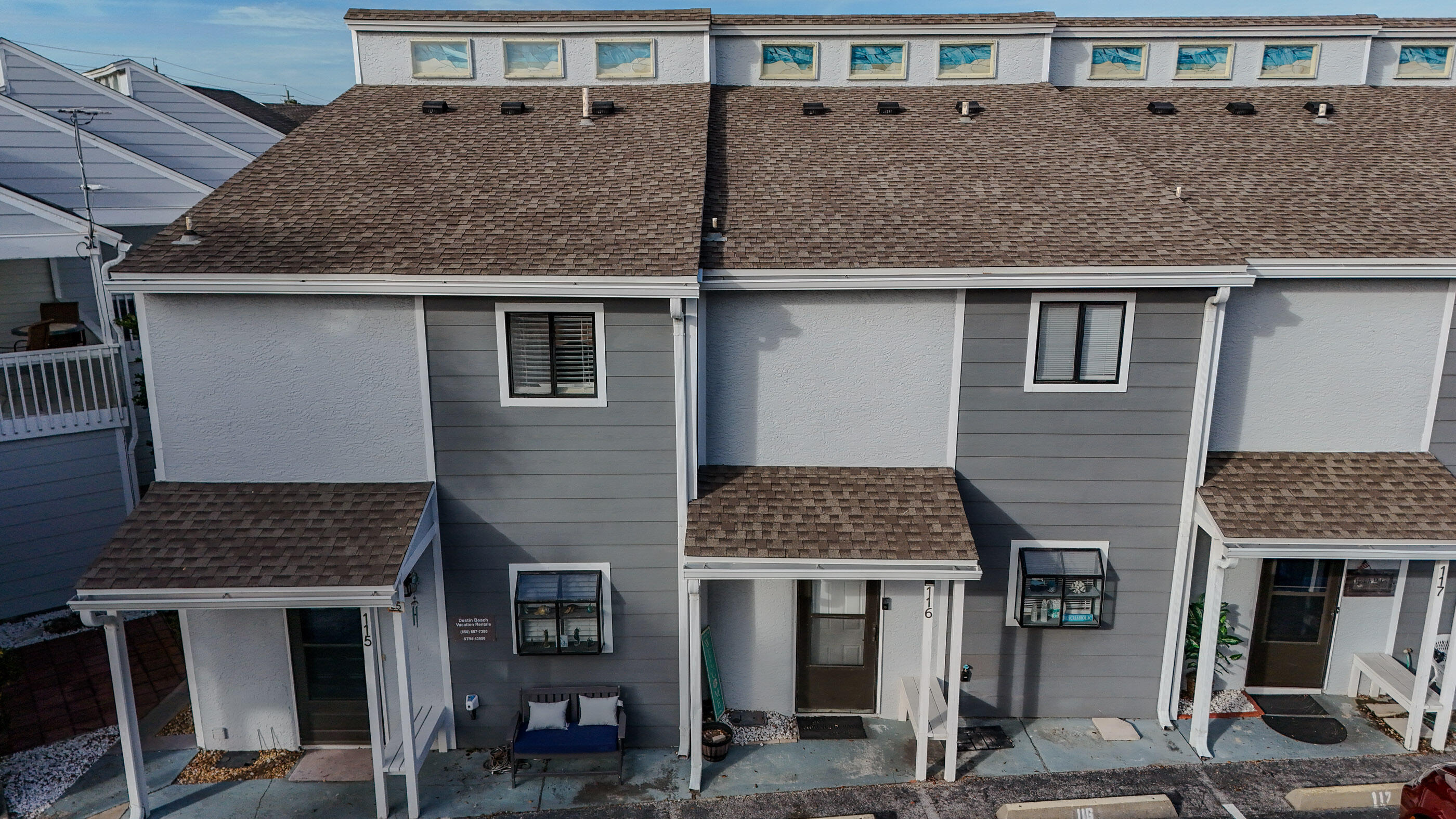 25 Misty Cove, Unit 116 Miramar Beach, FL 32550 - Photo 2 of 52 a front view of a house with more windows