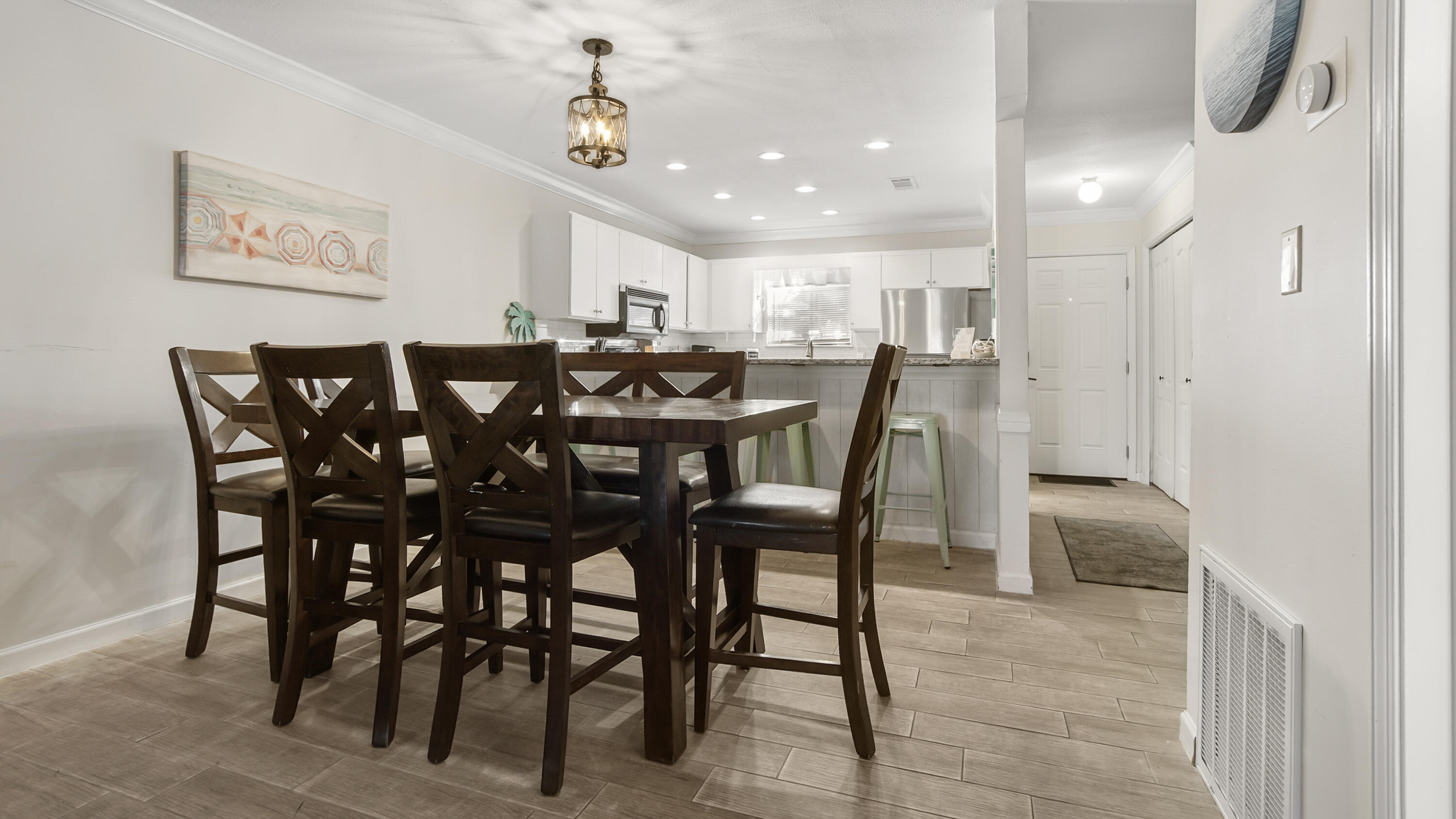 25 Misty Cove, Unit 116 Miramar Beach, FL 32550 - Photo 21 of 52 a view of a dining room and livingroom with furniture