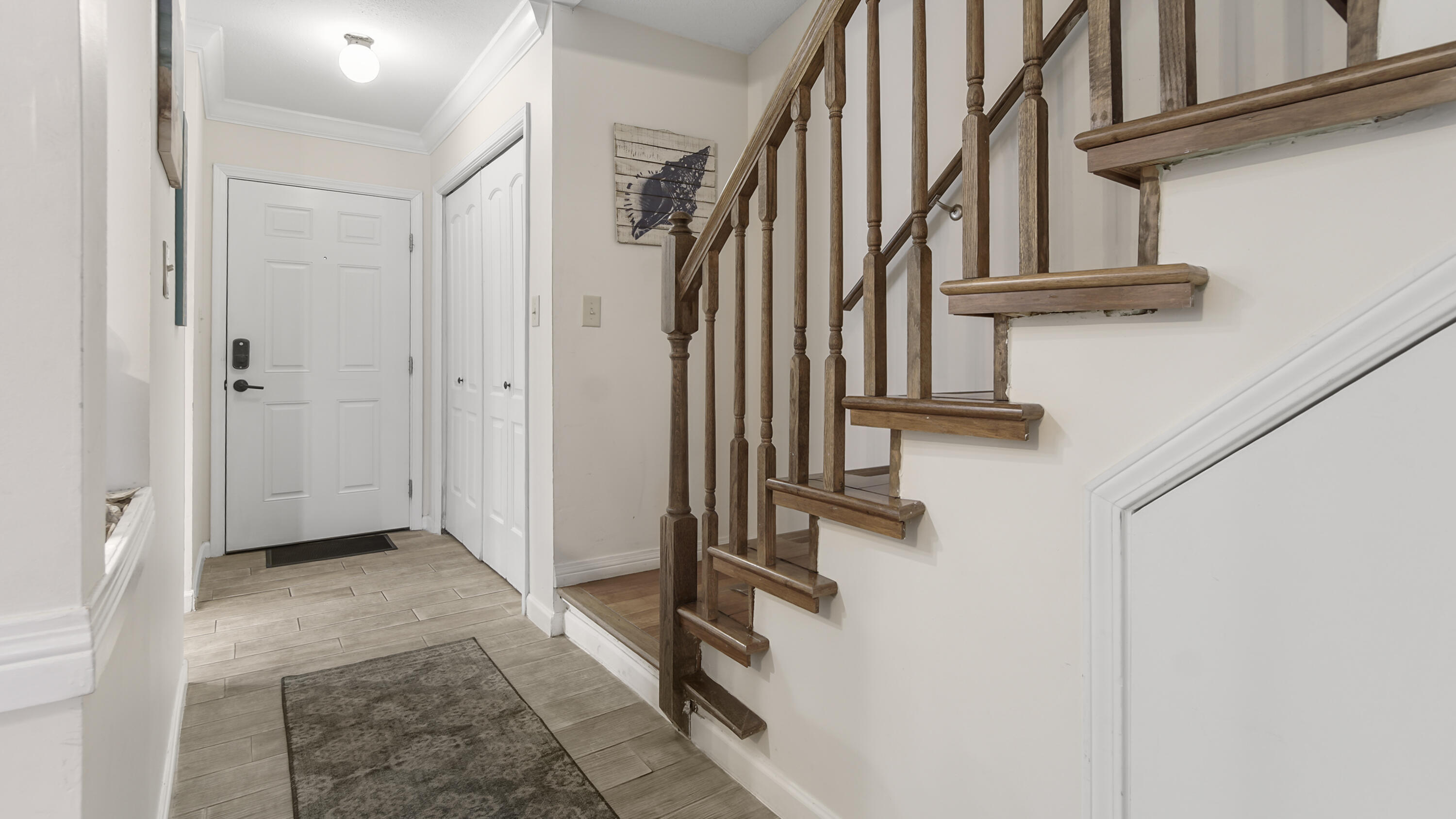 25 Misty Cove, Unit 116 Miramar Beach, FL 32550 - Photo 22 of 52 a view of hallway with stairs