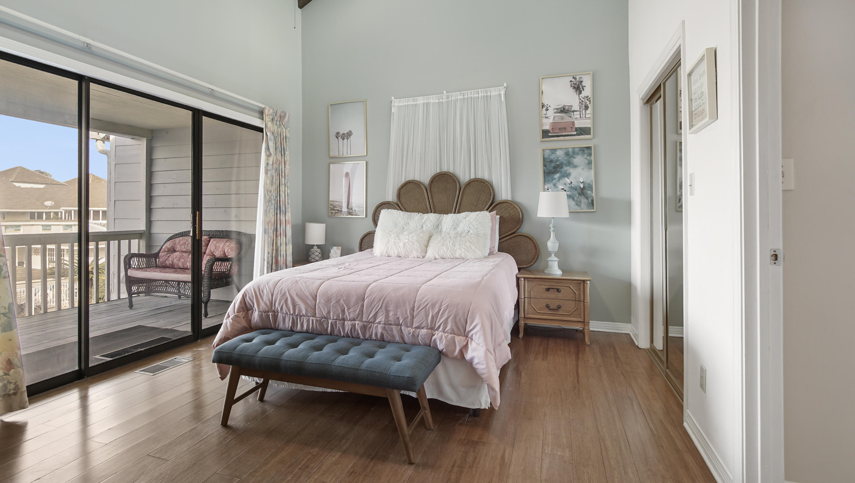 25 Misty Cove, Unit 116 Miramar Beach, FL 32550 - Photo 24 of 52 a bedroom with a bed and wooden floor