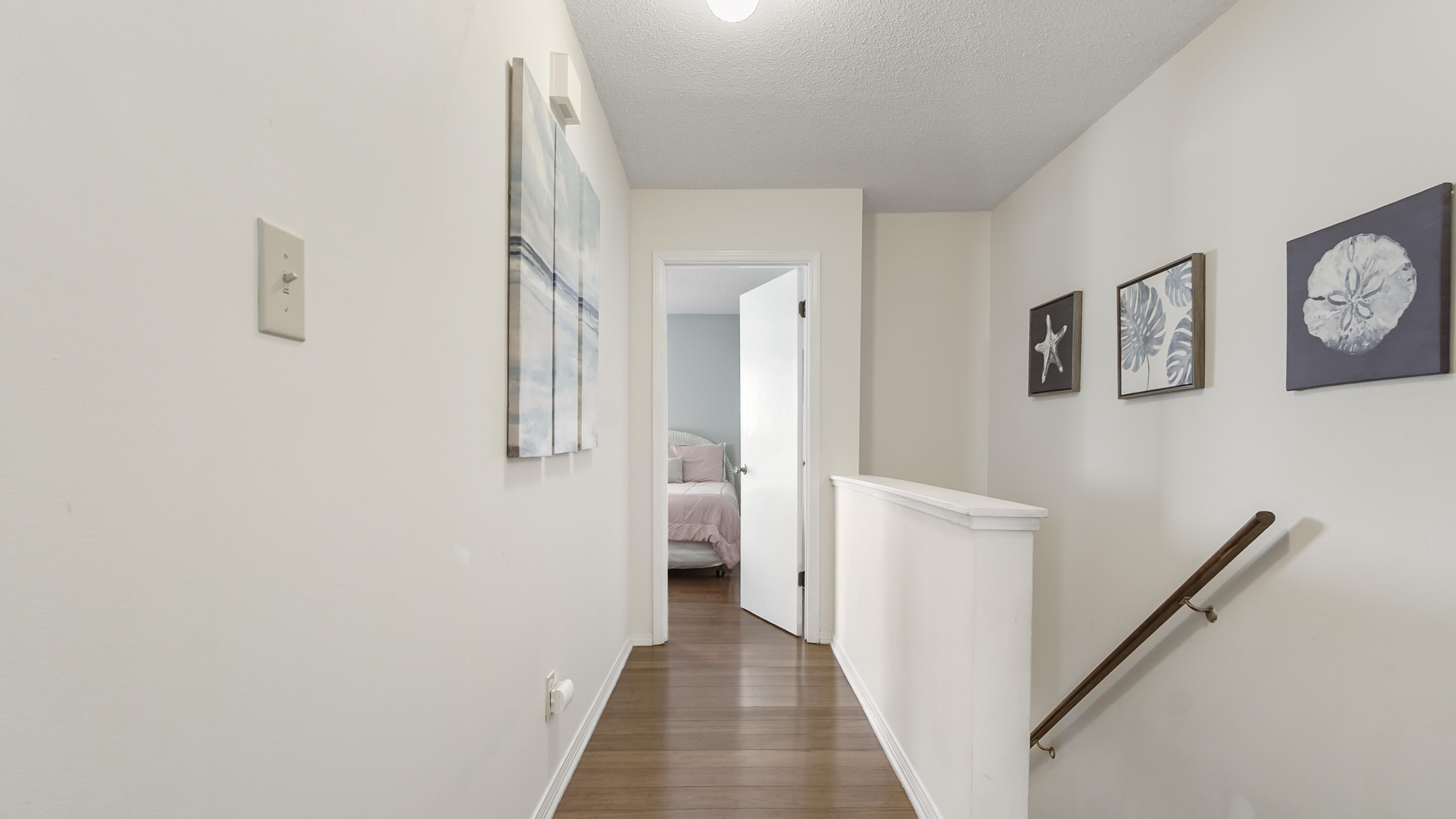 25 Misty Cove, Unit 116 Miramar Beach, FL 32550 - Photo 34 of 52 a view of a hallway with wooden floor and entryway