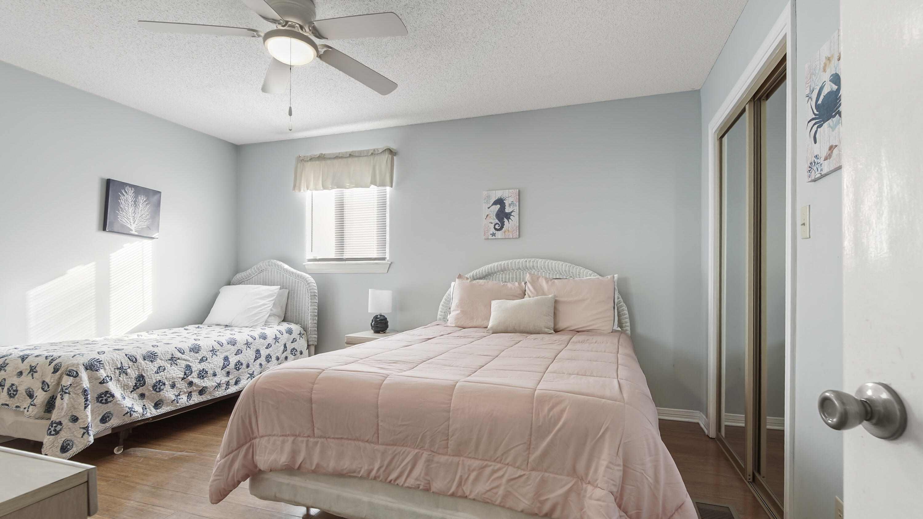 25 Misty Cove, Unit 116 Miramar Beach, FL 32550 - Photo 36 of 52 a bedroom with two beds and ceiling fan