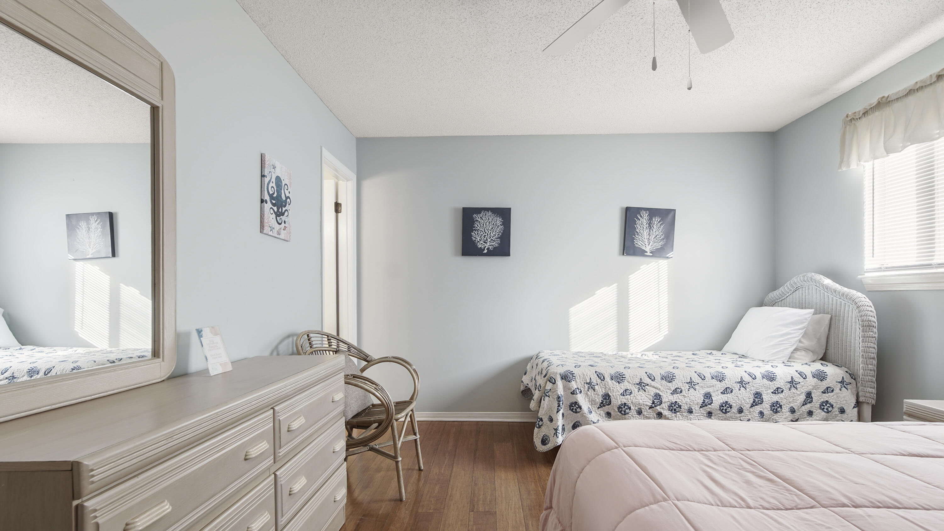 25 Misty Cove, Unit 116 Miramar Beach, FL 32550 - Photo 37 of 52 a bedroom with a bed and a dresser