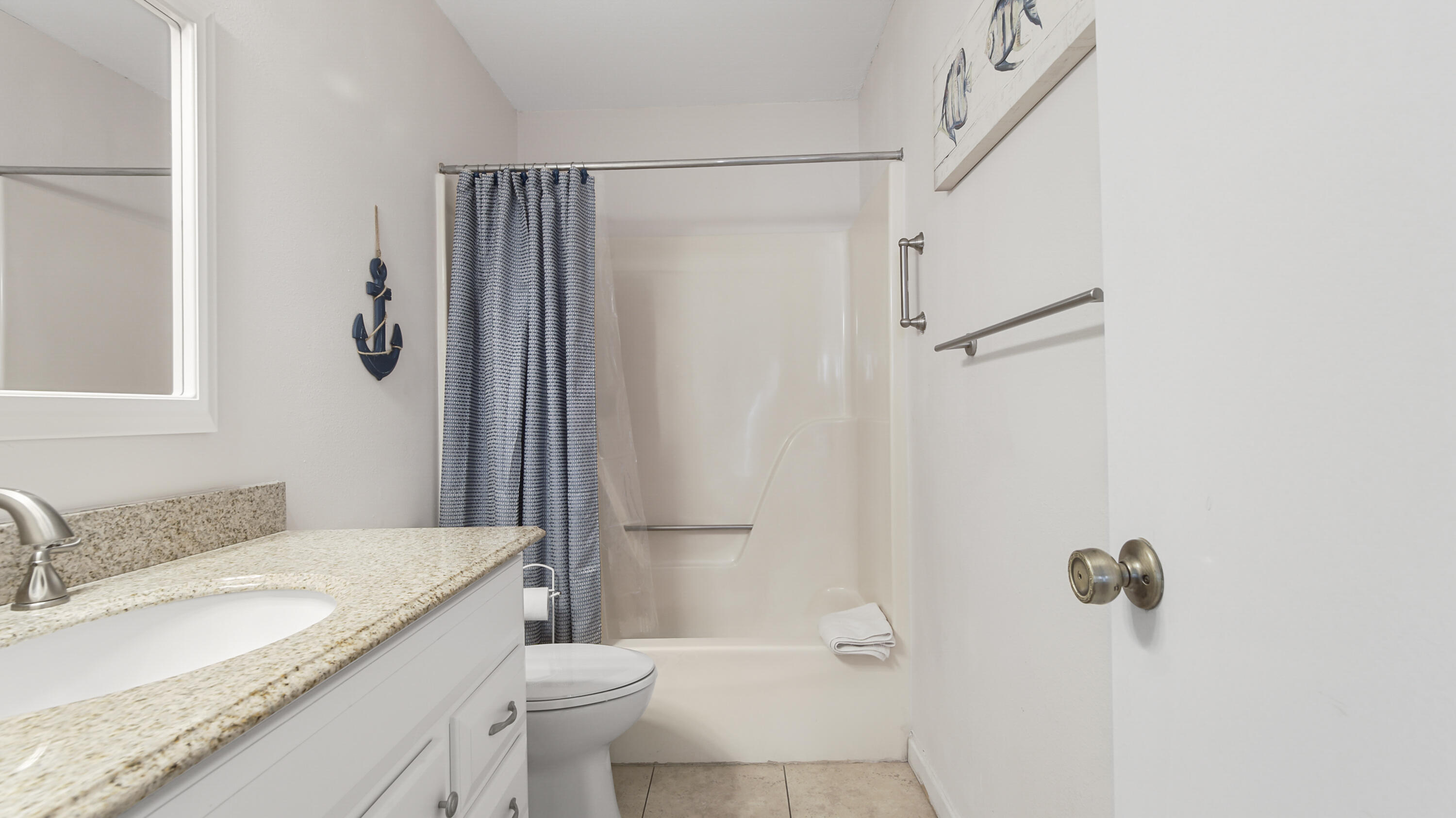 25 Misty Cove, Unit 116 Miramar Beach, FL 32550 - Photo 40 of 52 a bathroom with a granite countertop sink toilet and shower
