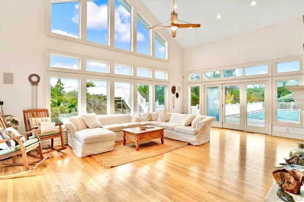 a view of a room with furniture and windows