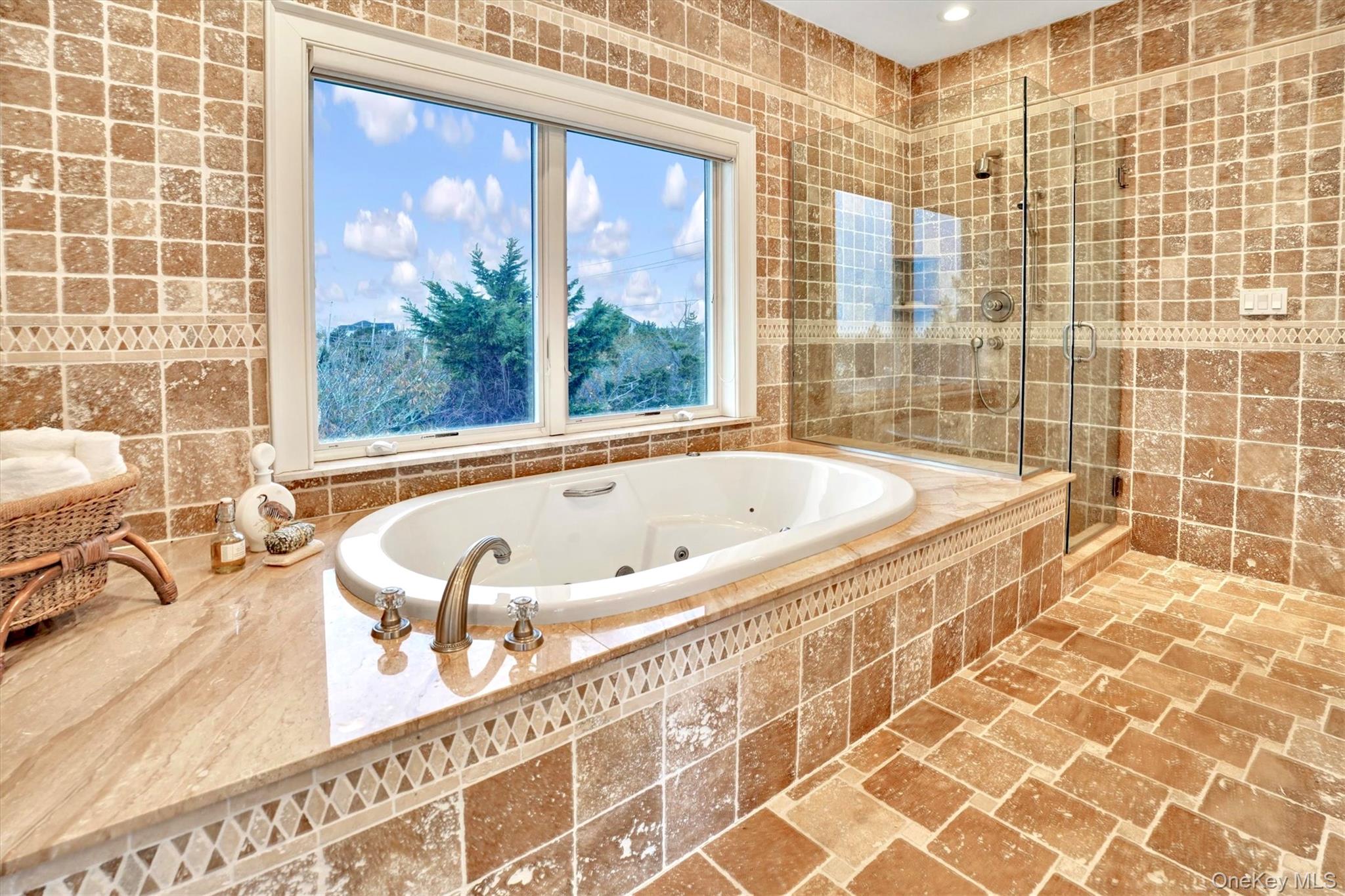 605 Dune Road Westhampton, NY 11978 - Photo 28 of 44 Second Floor Primary Bathroom en-suite with tile walls, a tub with jets, and a shower stall