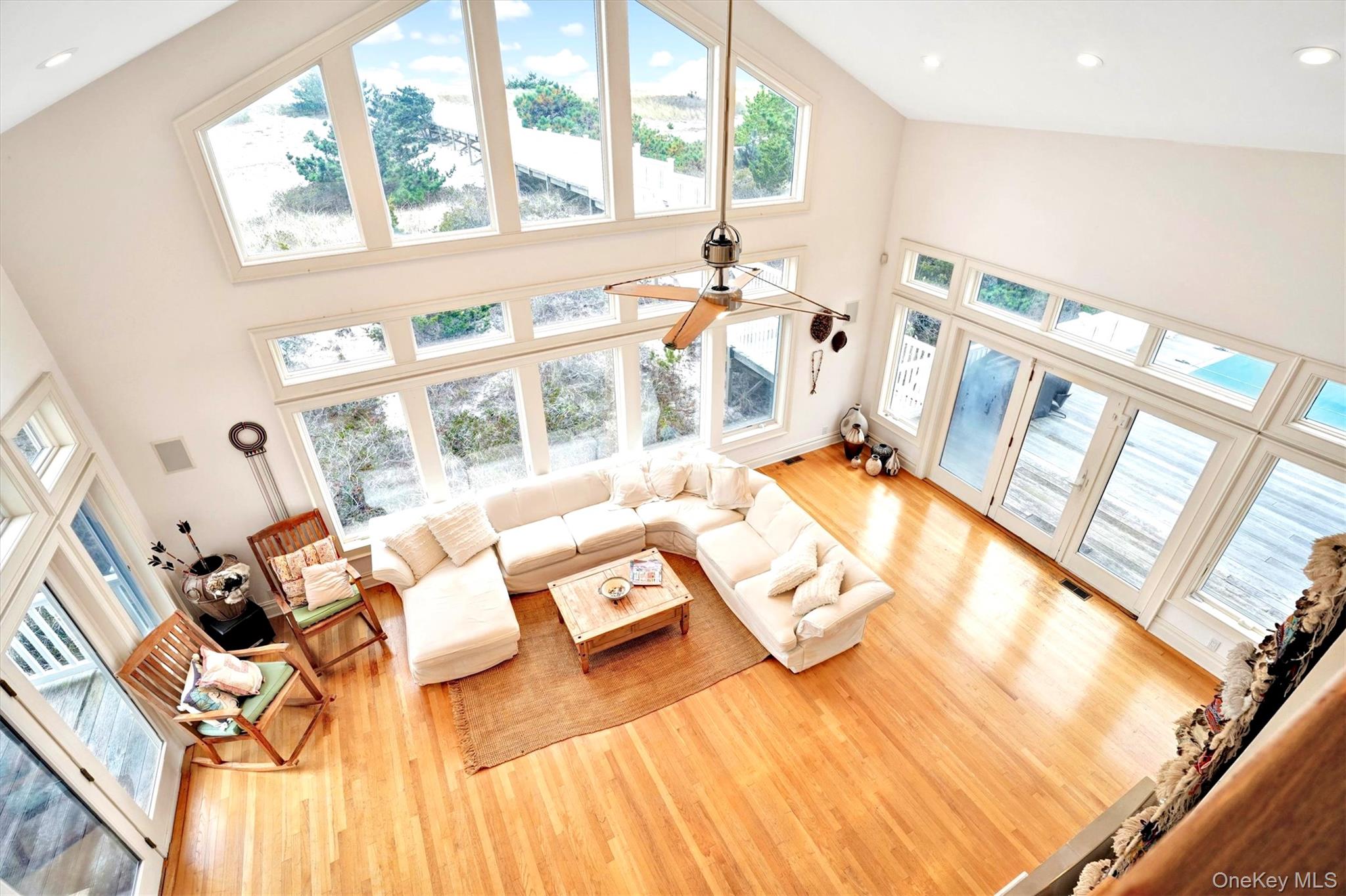 605 Dune Road Westhampton, NY 11978 - Photo 30 of 44 View from Second Floor family room overlooking the Living area featuring wood finished floors, a towering ceiling, and recessed lighting
