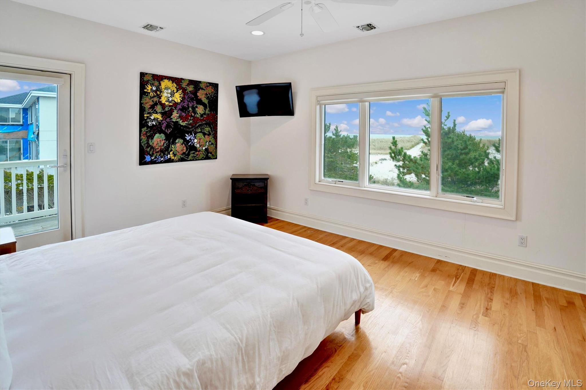 605 Dune Road Westhampton, NY 11978 - Photo 32 of 44 Third Oceanfront Bedroom with light wood-style floors, access to exterior, a ceiling fan, and recessed lighting
