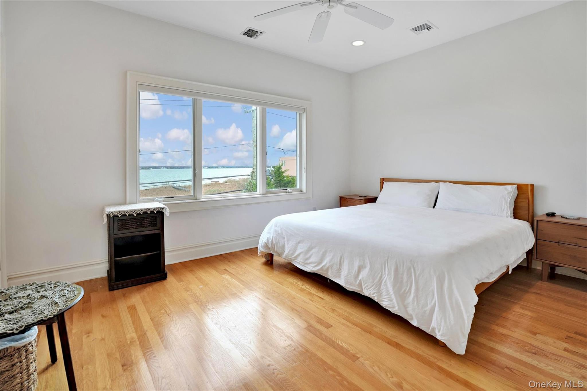 605 Dune Road Westhampton, NY 11978 - Photo 37 of 44 5th Bedroom with Bay views light wood-style floors, a water view, a ceiling fan, and recessed lighting
