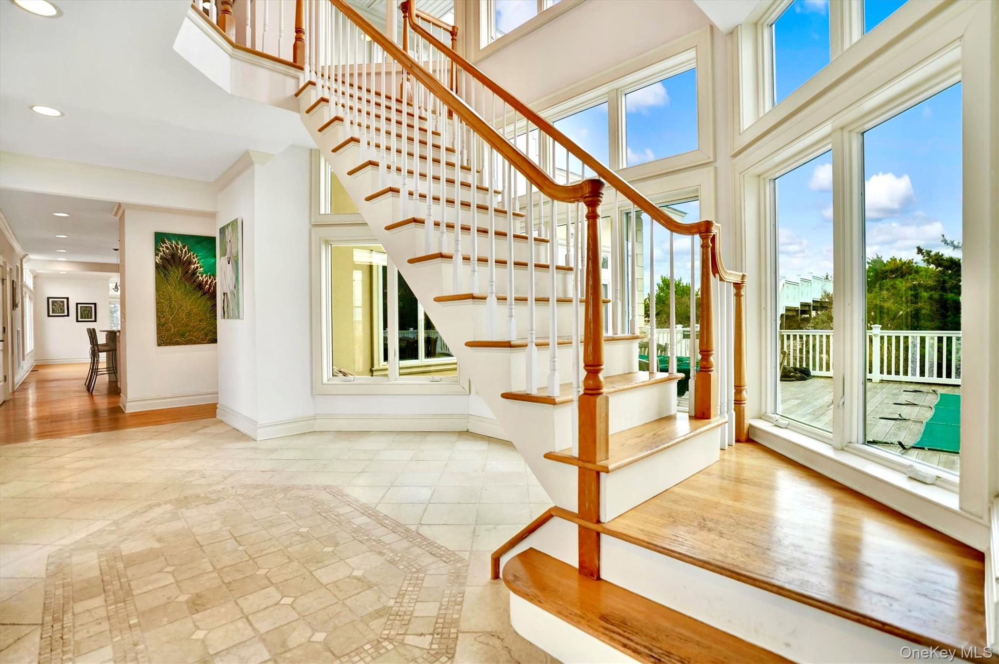 605 Dune Road Westhampton, NY 11978 - Photo 8 of 44 Stairs featuring recessed lighting, a towering ceiling, and inlaid floor details