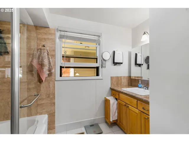 a bathroom with a sink and mirror