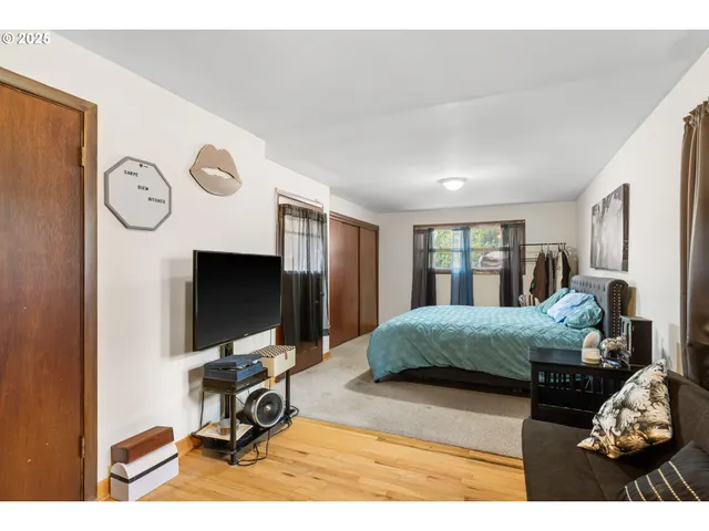 a living room with furniture gym equipment and a flat screen tv