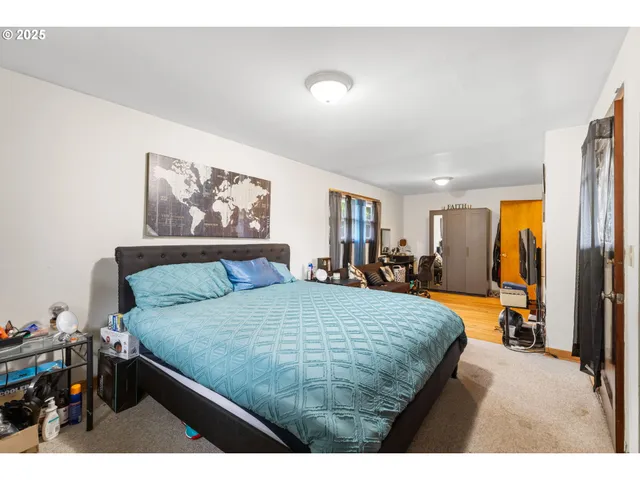 a bed room with a bed and a large mirror