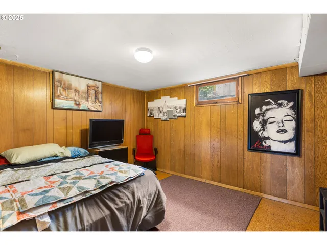 a bedroom with a bed and cupboard