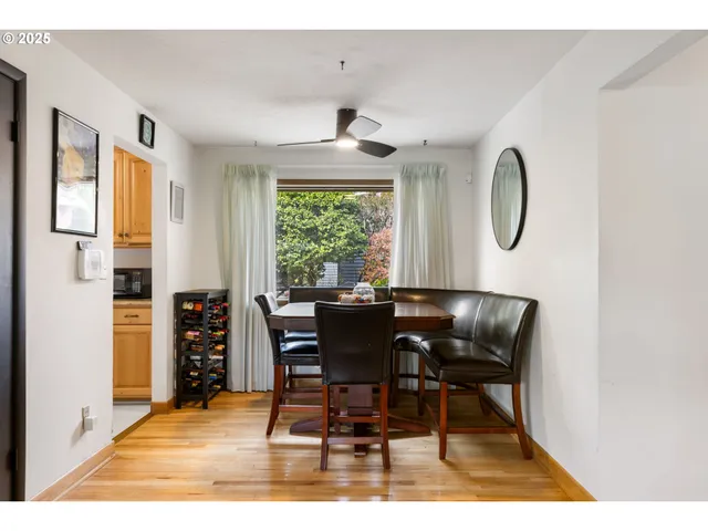 a dining room with furniture and window