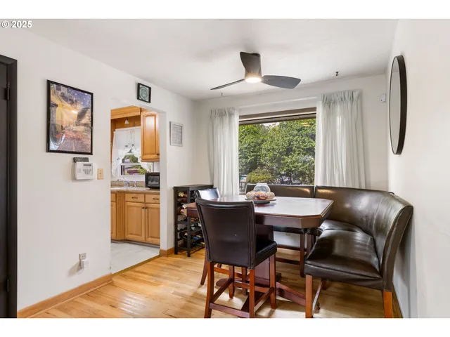 a dining room with furniture and window