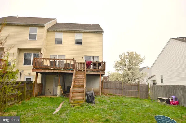 a view of a house with a swimming pool and a garden