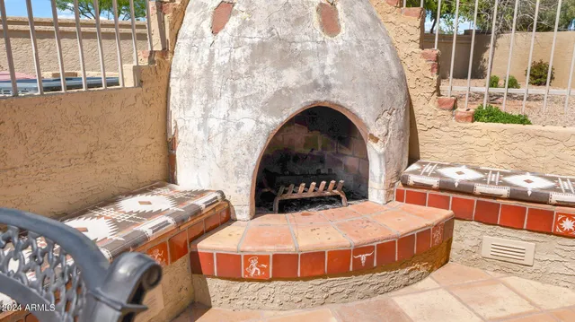 a bedroom with furniture and a fireplace