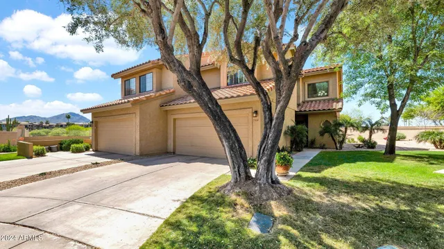 a house with yard in front of it