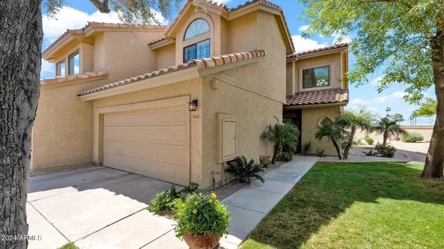 front view of a house with a yard