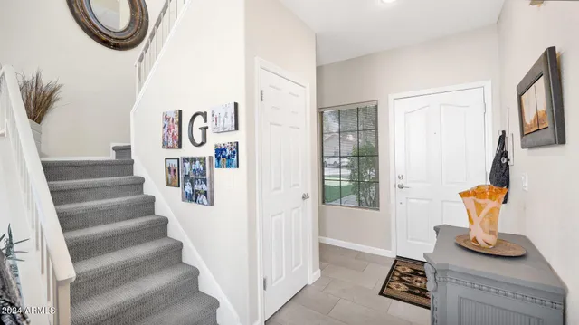 a view of entryway with furniture and a window