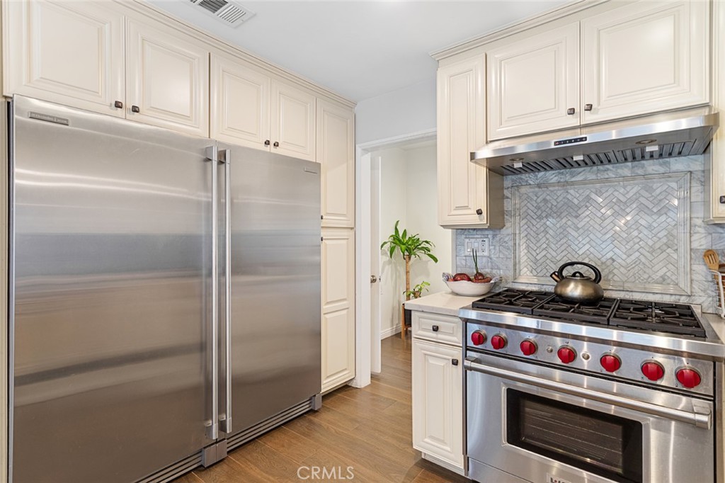 1626 Rodeo Road Arcadia, CA 91006 - Photo 12 of 28 a kitchen with stainless steel appliances granite countertop a stove and a refrigerator