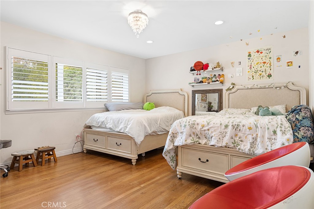 1626 Rodeo Road Arcadia, CA 91006 - Photo 17 of 28 a bedroom with two beds and a chandelier