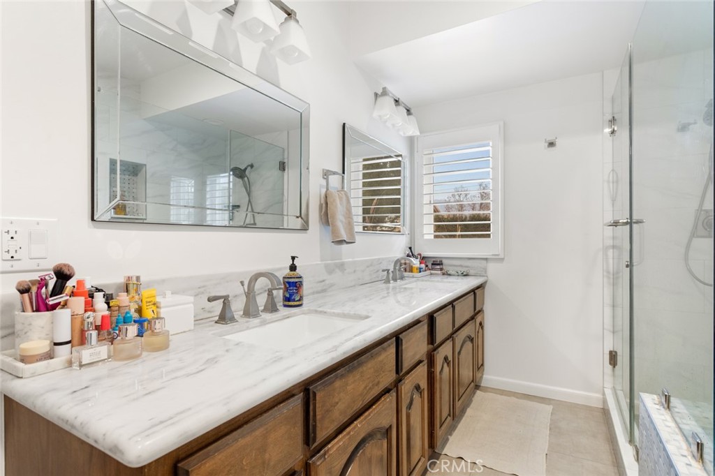 1626 Rodeo Road Arcadia, CA 91006 - Photo 19 of 28 a bathroom with a sink a vanity and a large mirror