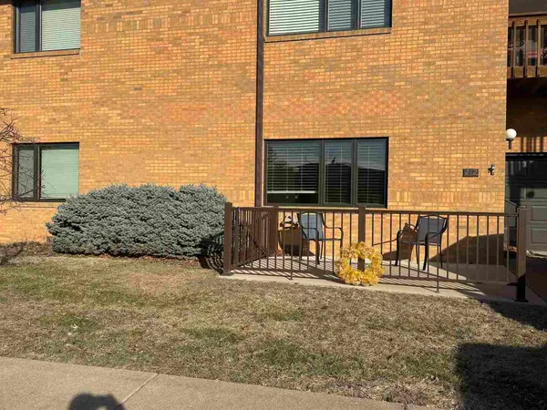 a view of house with wooden fence