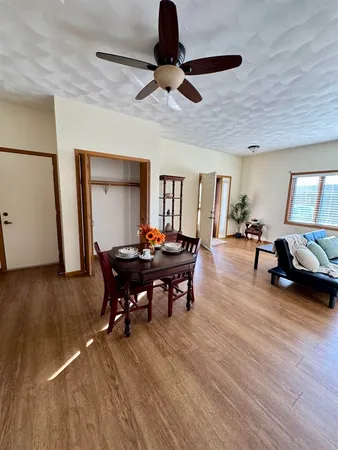 a view of a livingroom with furniture and a floor to ceiling window