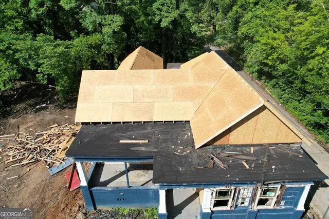 a aerial view of a house with a yard