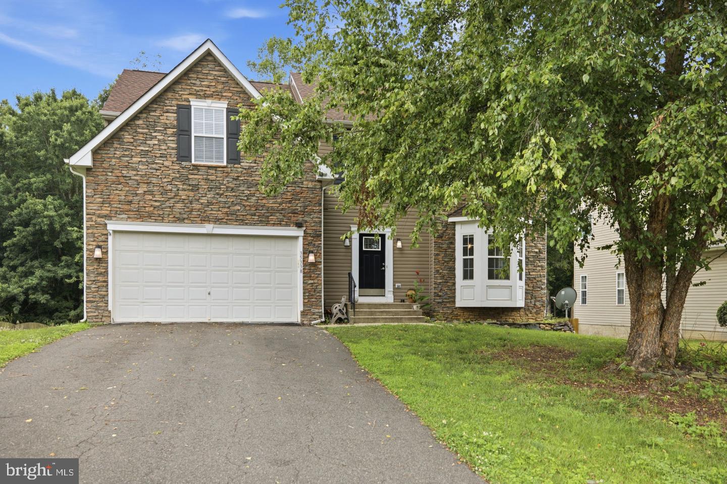 35338 Pheasant Ridge Road Locust Grove, VA 22508 - Photo 3 of 39 Charming home with lush greenery.