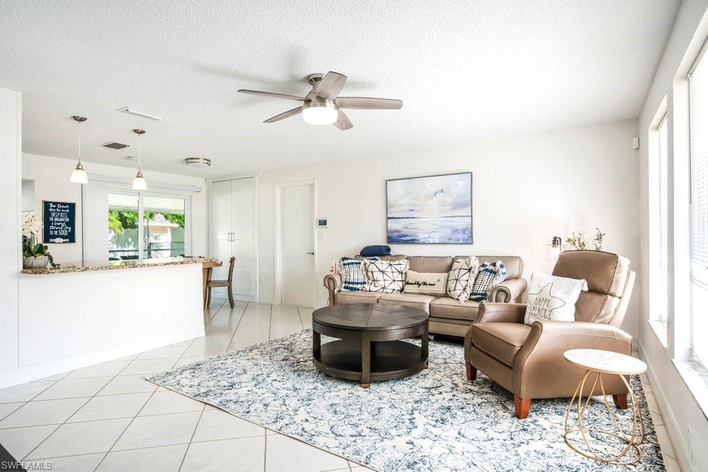 1207 Hernando Street Naples, FL 34103 - Photo 5 of 37 a living room with furniture and a rug