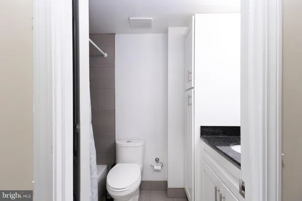 a bathroom with a toilet and a sink