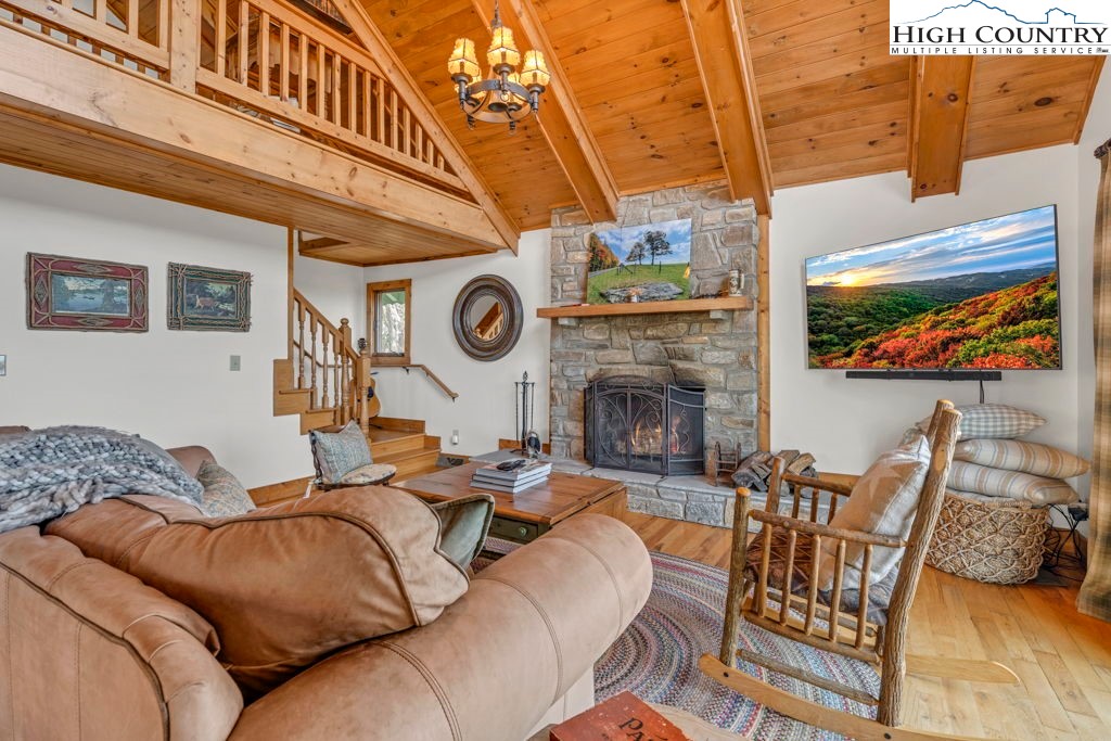 198 Laurel Hill Lane Boone, NC 28607 - Photo 13 of 50 a living room with furniture and a fireplace