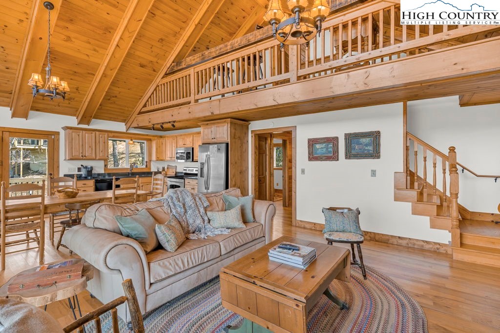 198 Laurel Hill Lane Boone, NC 28607 - Photo 19 of 50 a view of living room kitchen with furniture and wooden floor
